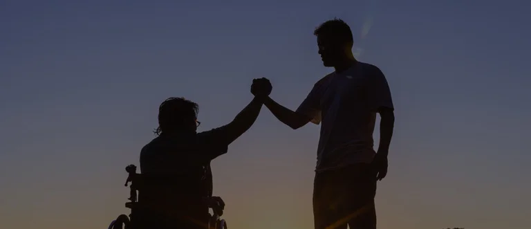 Two man holding each other hands